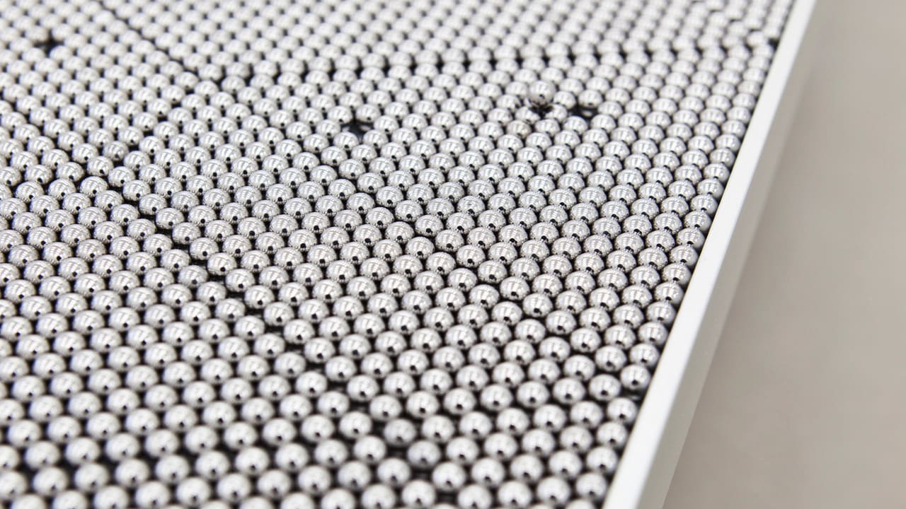 Watch Thousands Of Ball Bearings Scatter In This Sculpture