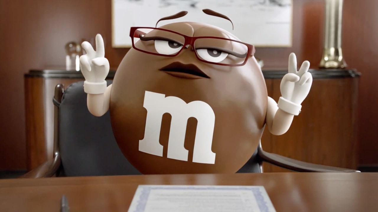 Ad Worlds Collide As Geico Gecko Stars In New M&M Commercial The